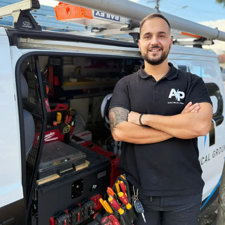 Professional headshot of Panos from AP Electrical Group in a high-vis uniform