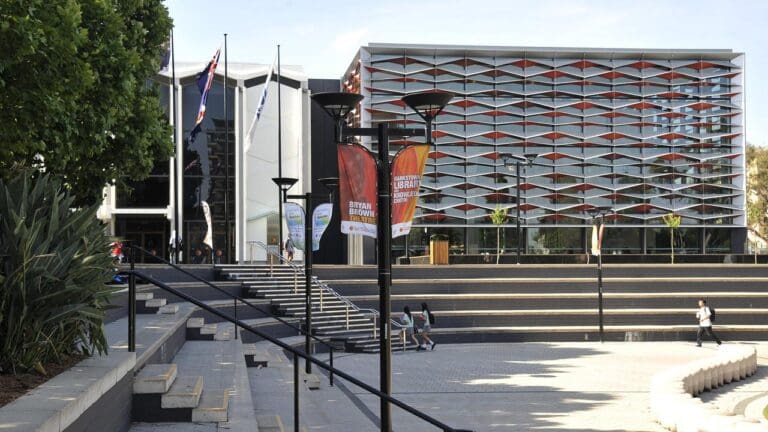 Bankstown Library and Knowledge Centre with banners for Bryan Brown Theatre, steps, and modern façade.