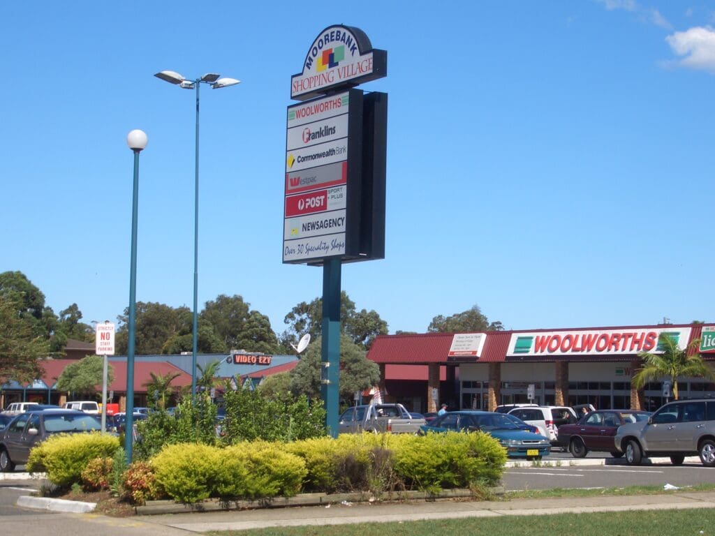 Moorebank Shopping Village with Woolworths, banks, Australia Post, and over 30 specialty stores.